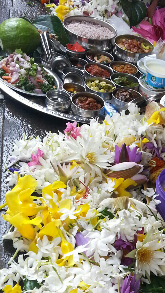 8 vegetarian curries and some delicious sides being offered to Lord Buddha during Poya (full moon) lunch.